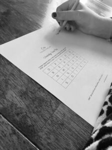 A black-and-white picture of a student working on a morphology word find